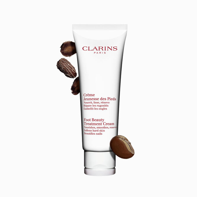 ภาพผลิตภัณฑ์ของขวด Clarins Foot Beauty Treatment Cream ที่วางใกล้กับเมล็ดเชีย บนพื้นหลังสีขาว