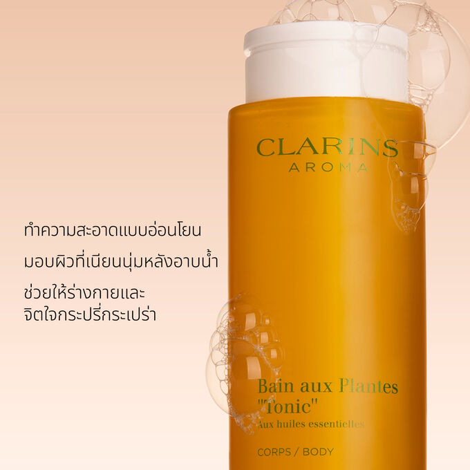 ภาพผลิตภัณฑ์ของ Clarins Tonic Bath และ Shower Concentrate พร้อมข้อความที่เน้นว่าเป็นเจลอาบน้ำจากพืชธรรมชาติที่มีกลิ่นหอม