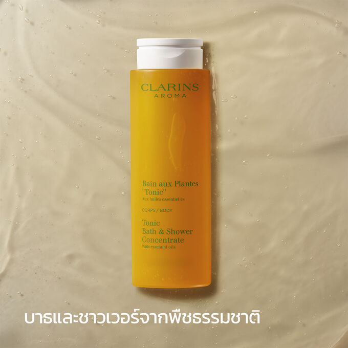 ภาพผลิตภัณฑ์ของ Clarins Tonic Bath และ Shower Concentrate พร้อมข้อความที่เน้นว่าเป็นเจลอาบน้ำจากพืชธรรมชาติที่มีกลิ่นหอม